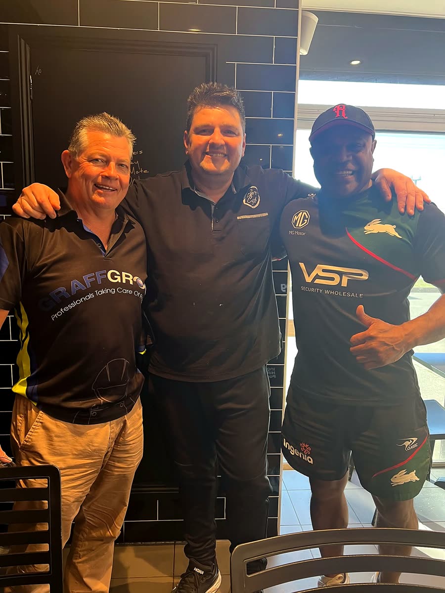 Richard with two regulars inside the cafe