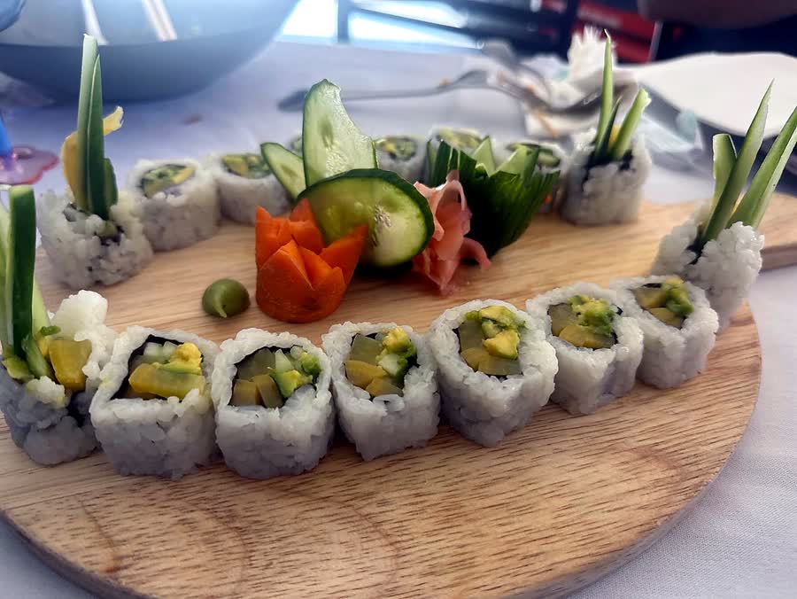 Sushi rolls arranged on a wooden board